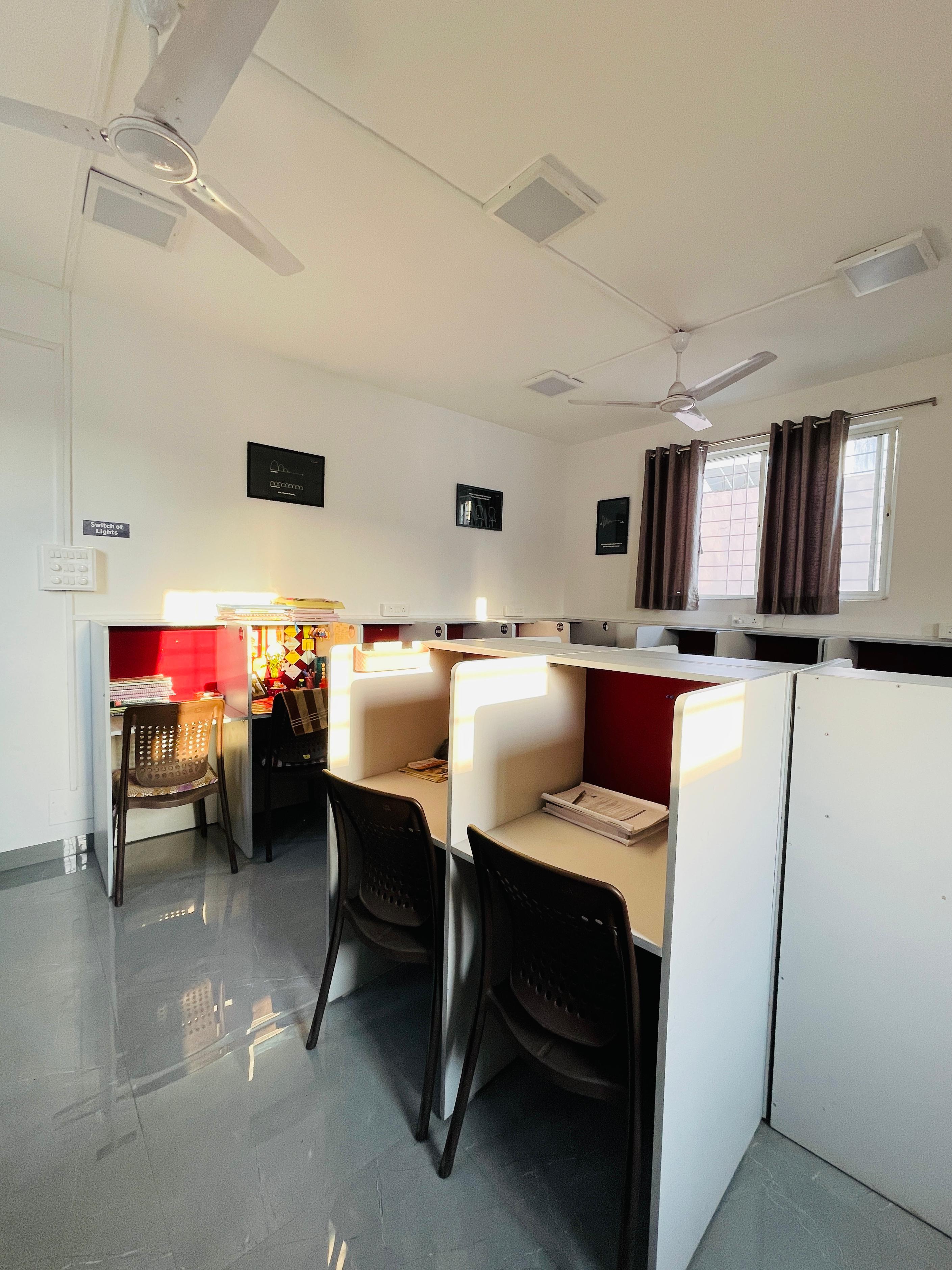 Modern study room in Pune with comfortable seating and AC